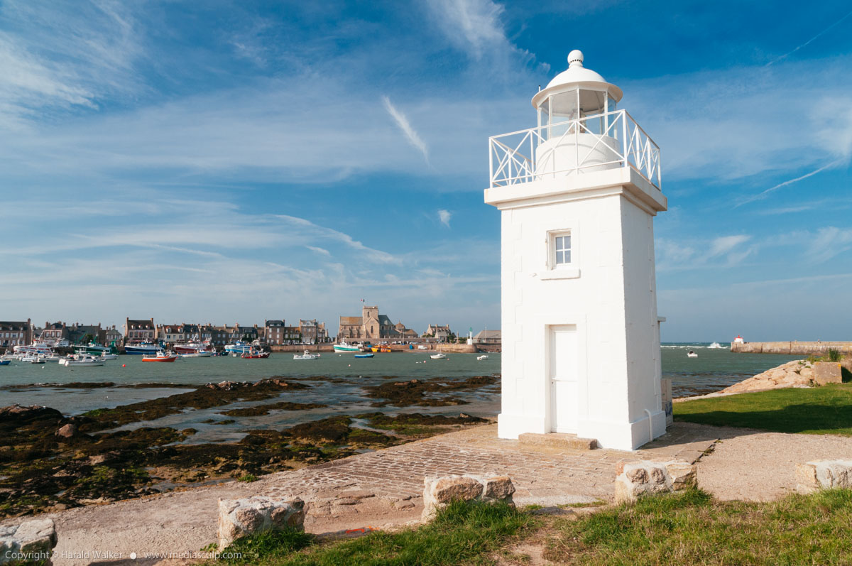 Stock photo of Barfleur lighthouse and harbor