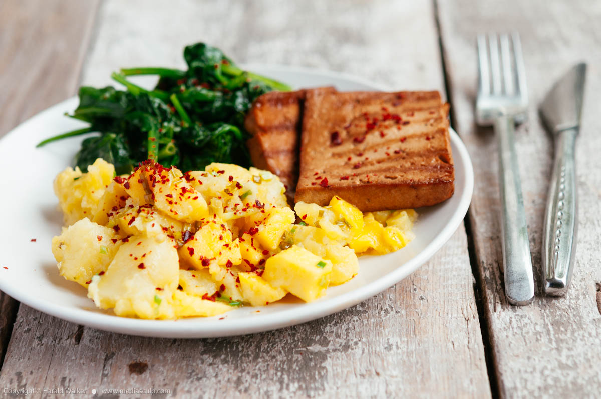 Stock photo of Grilled tofu with mango and chilli crushed potatoes