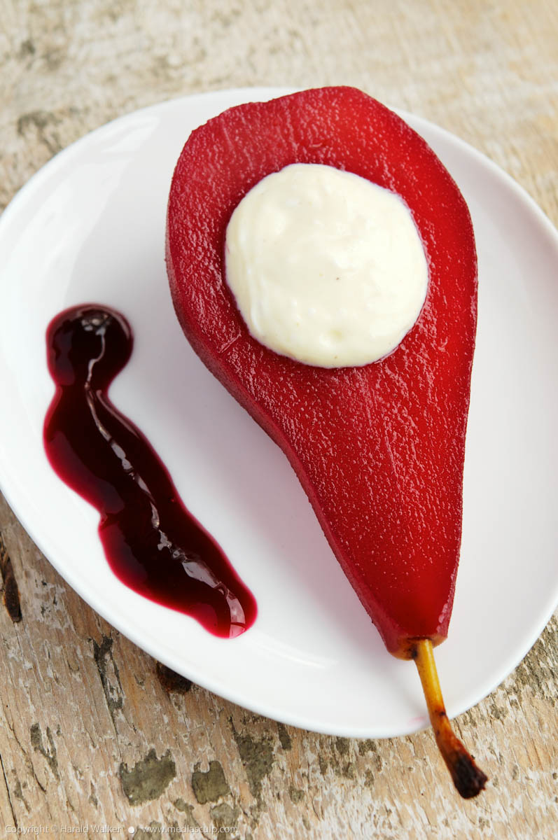 Stock photo of Red wine poached pears with vanilla bean mascarpone filling