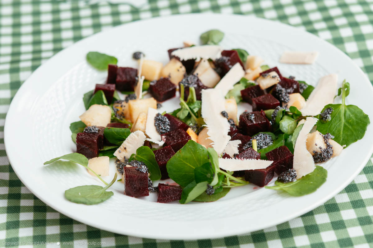 Stock photo of Beet and Pear Salad On Watercress with Poppyseed Dressing