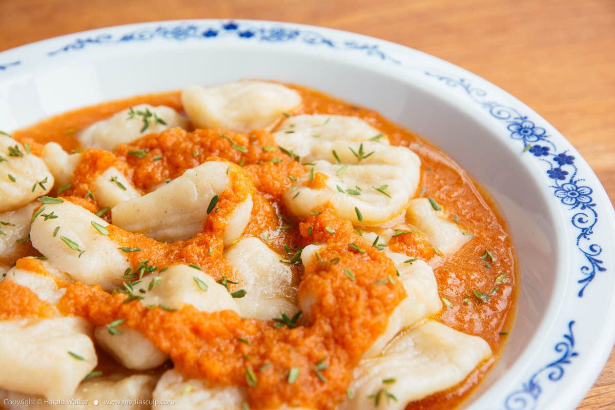 Stock photo of Celery Root Gnocchi with Apple Carrot Sauce