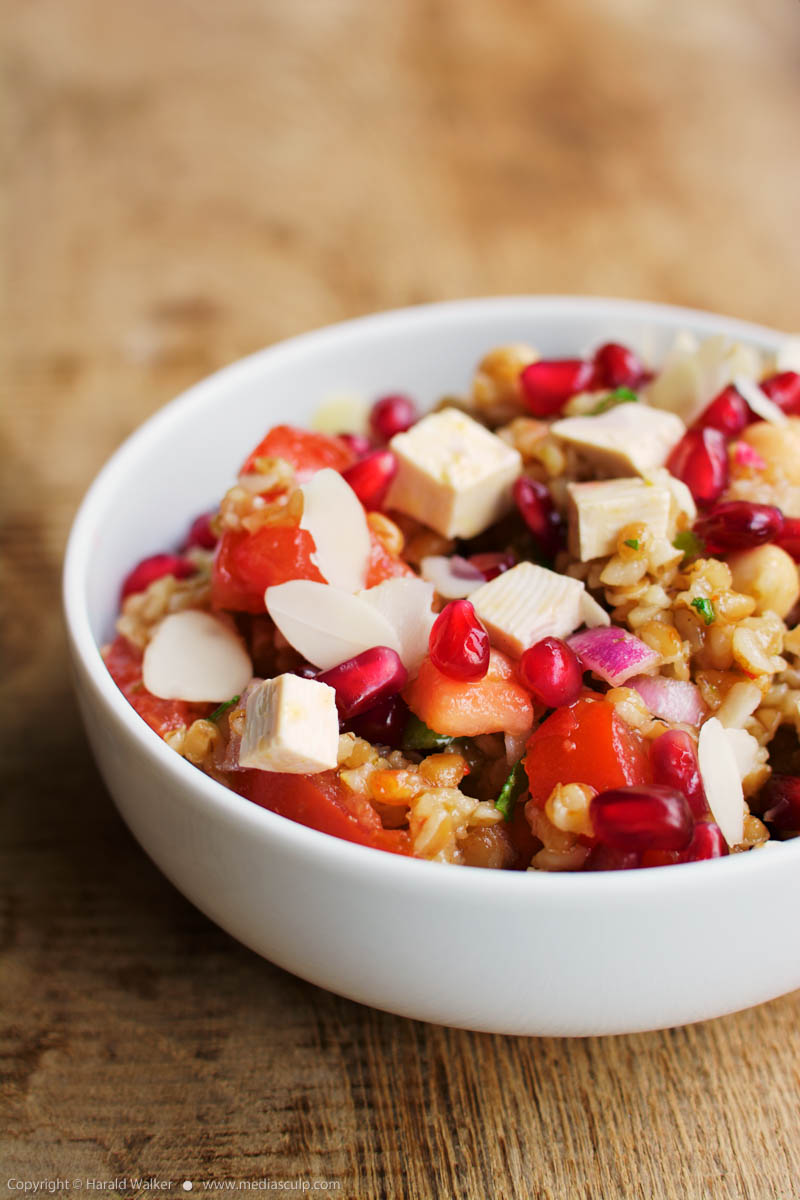 Stock photo of Bulgur Tomato Salad with Pomegranate Arils Mint and Almonds