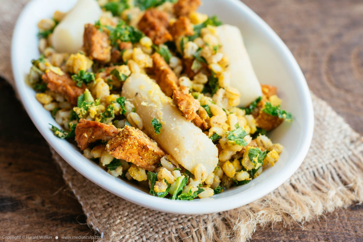 Stock photo of Salsify with Pearl Barley, Kale and Spicy Tofu Pieces