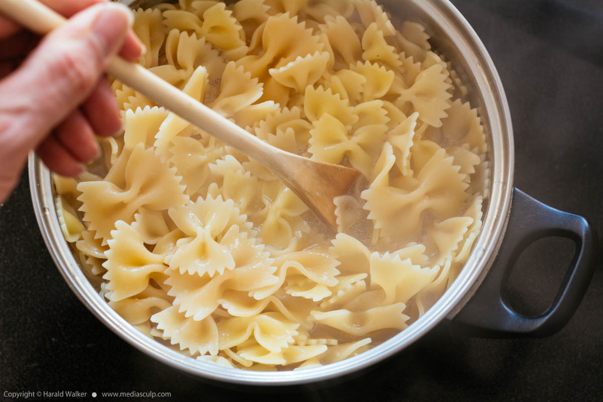 Stock photo of Cooking Farfalle pasta