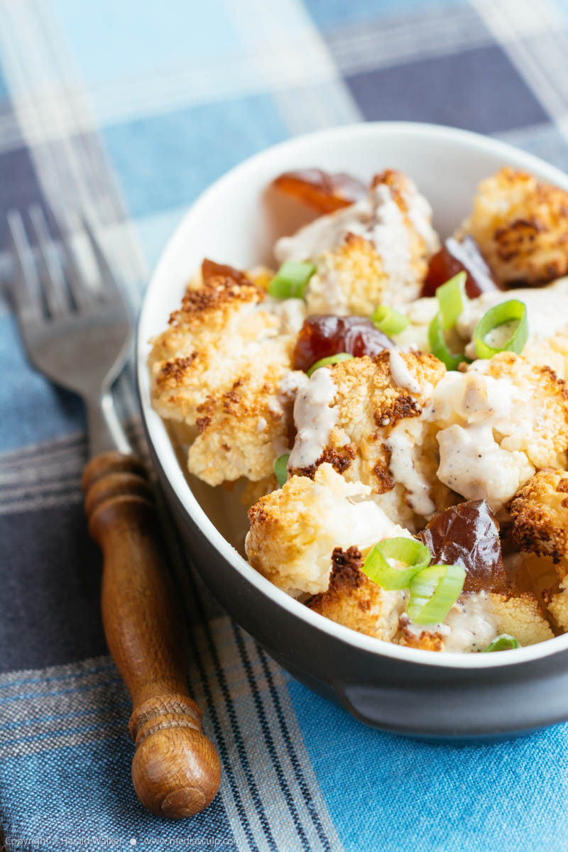 Stock photo of Roasted Cauliflower with Dates and Tahini Dressing