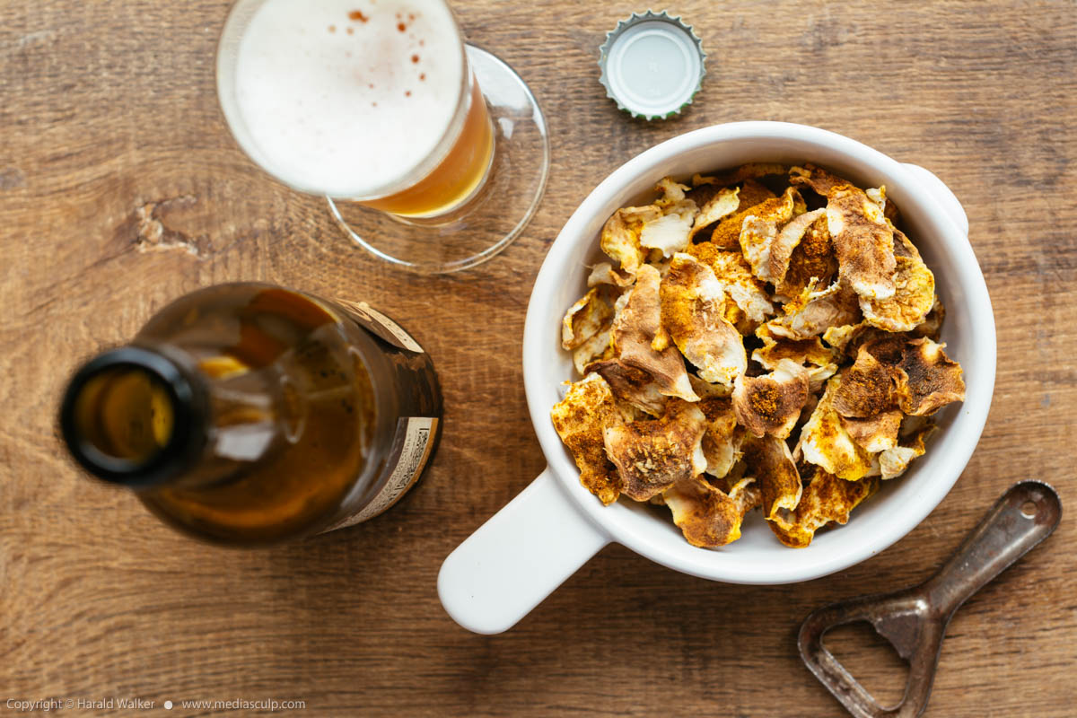 Stock photo of Turnip chips and beer
