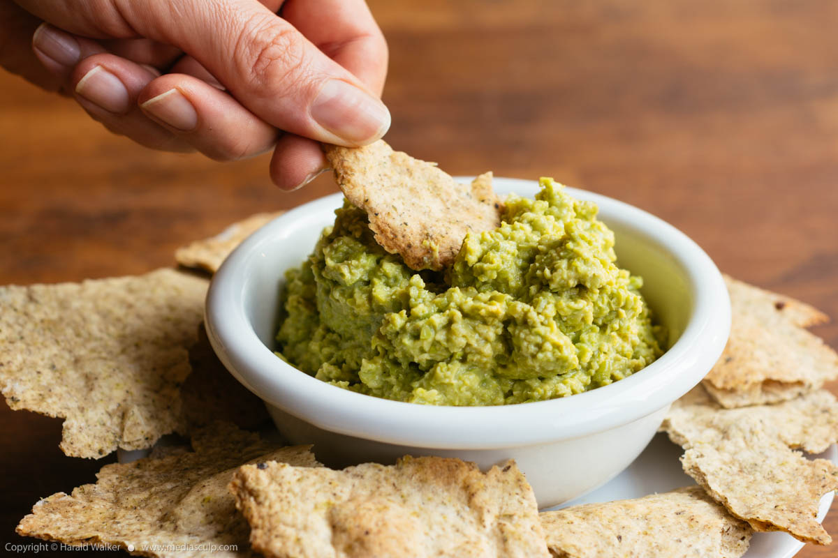 Stock photo of Home-made Herbed Crackers with Avocado Pea Spread