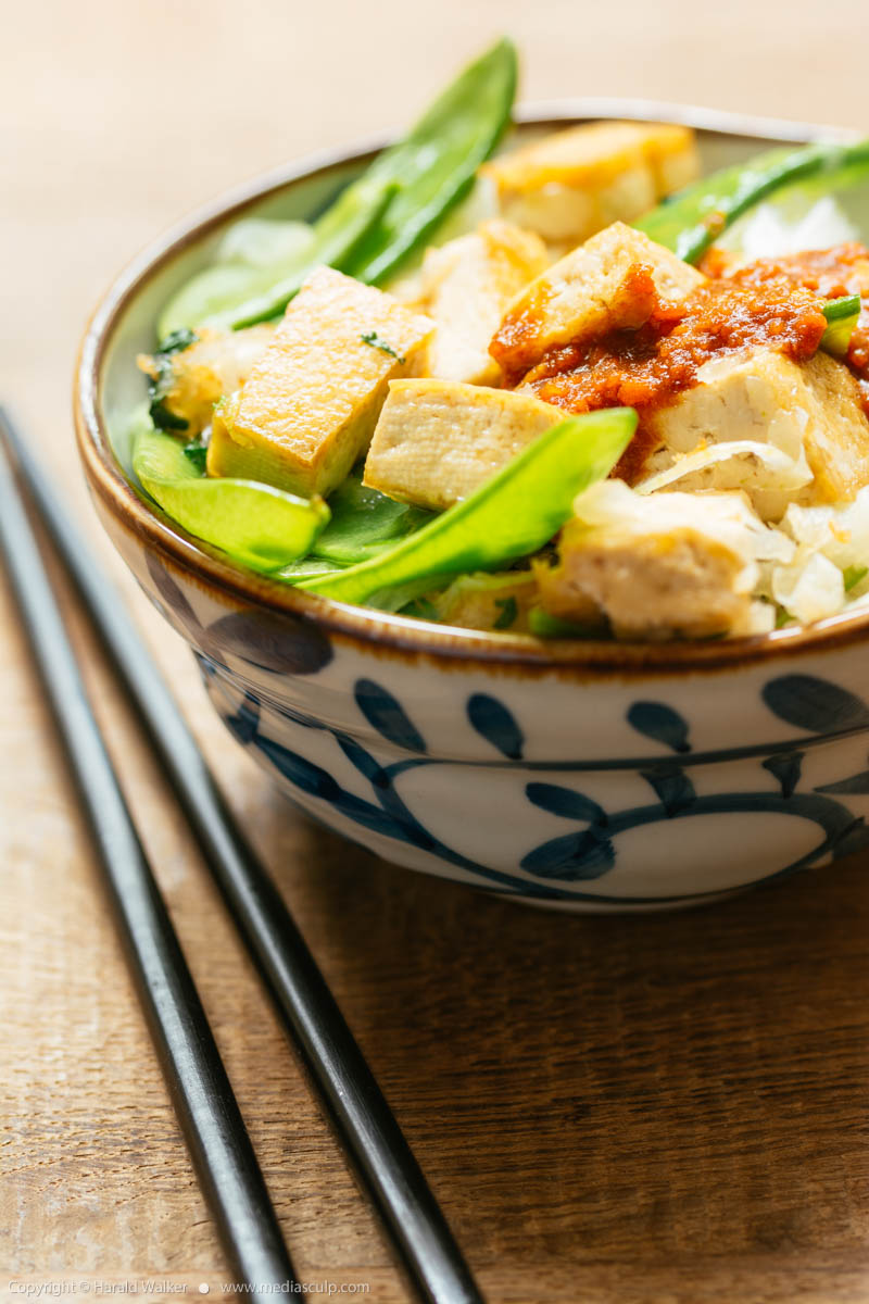 Stock photo of Thai style tofu and snow peas