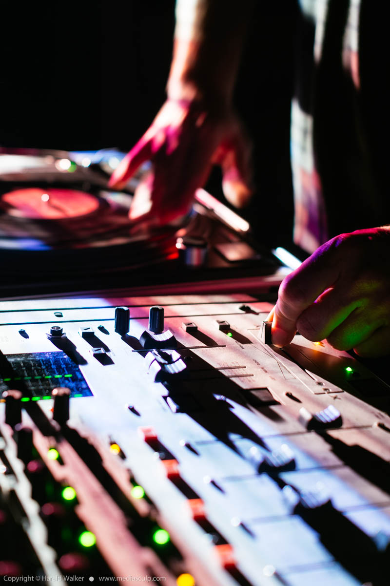 Stock photo of DJ scratching and mixing