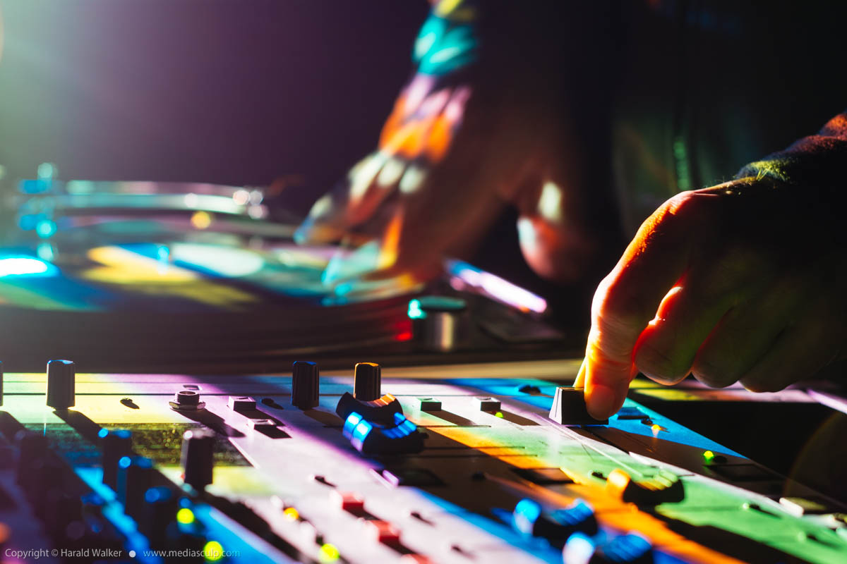 Stock photo of DJ scratching and mixing