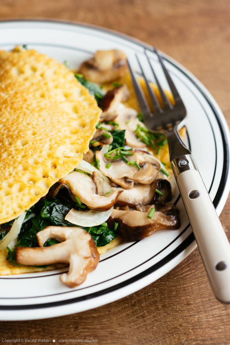 Stock photo of Creamy mushroom and spinach crepes