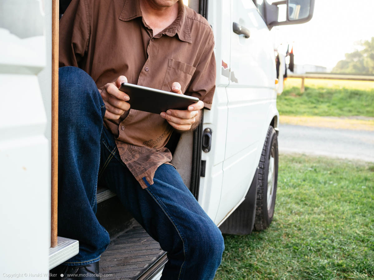 Stock photo of Traveler looking up information