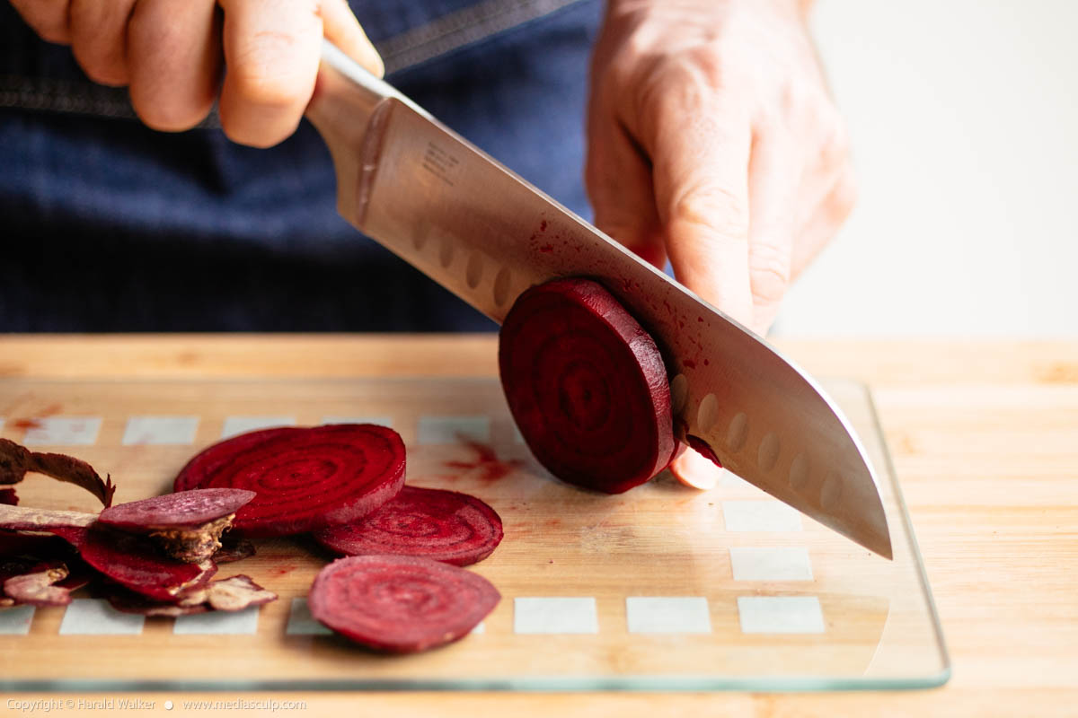 Stock photo of Cutting red beets