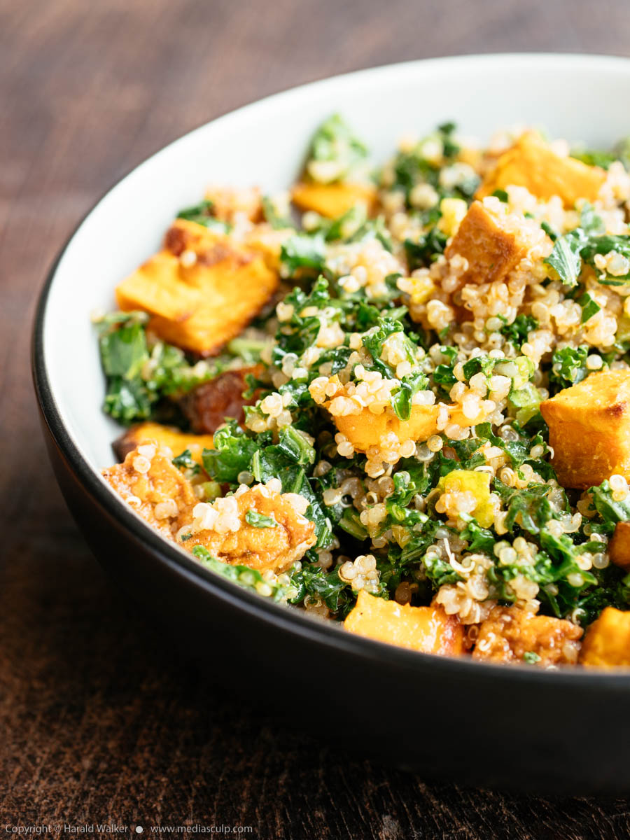 Stock photo of Quinoa kale sweet potato salad with tofu