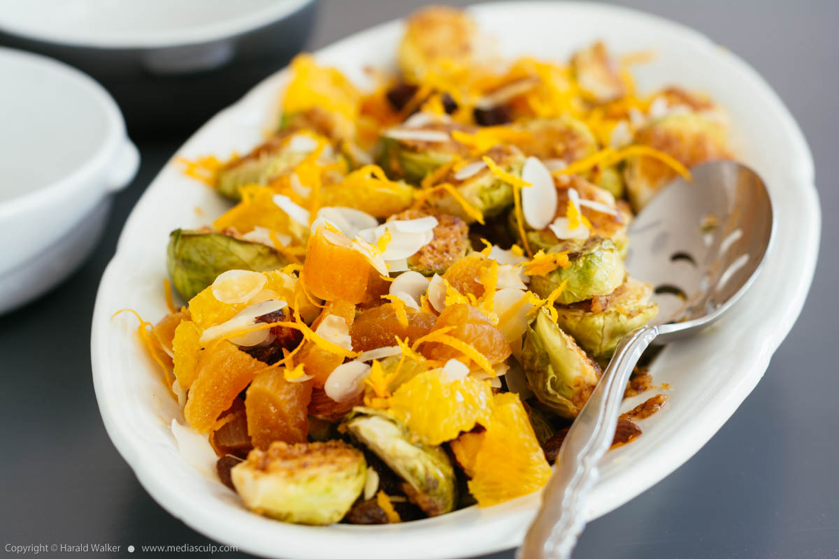Stock photo of Roasted Brussels Sprouts with Maple Mustard Sauce, Apricots, Raisins, Almonds and Oranges