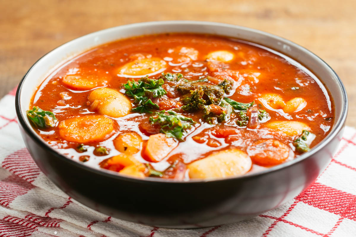 Stock photo of Giant bean soup with kale and carrots