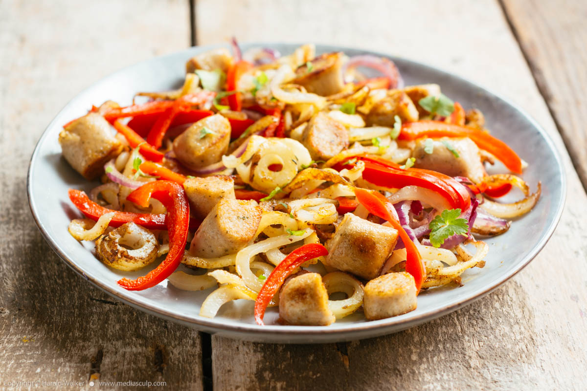 Stock photo of Roasted Spiralzed Potatoes with Peppers and Vegan Sausage