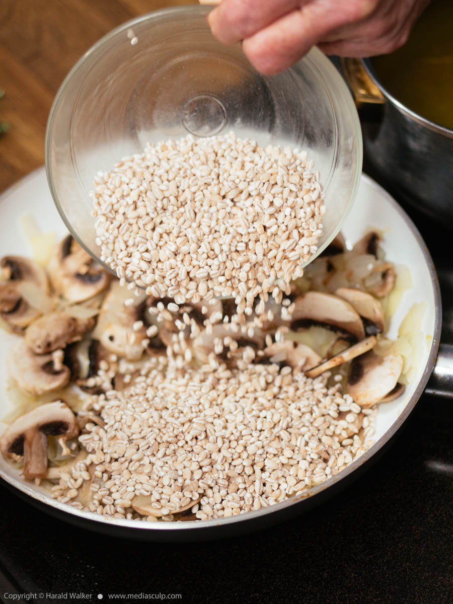 Stock photo of Making barley mushroom risotto