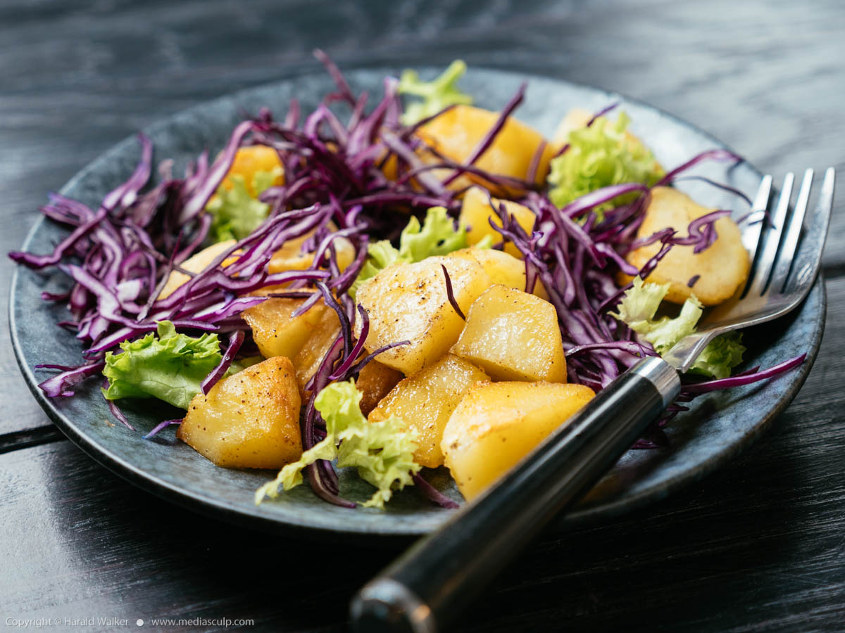 Stock photo of Warm Potato Salad with Red Cabbage