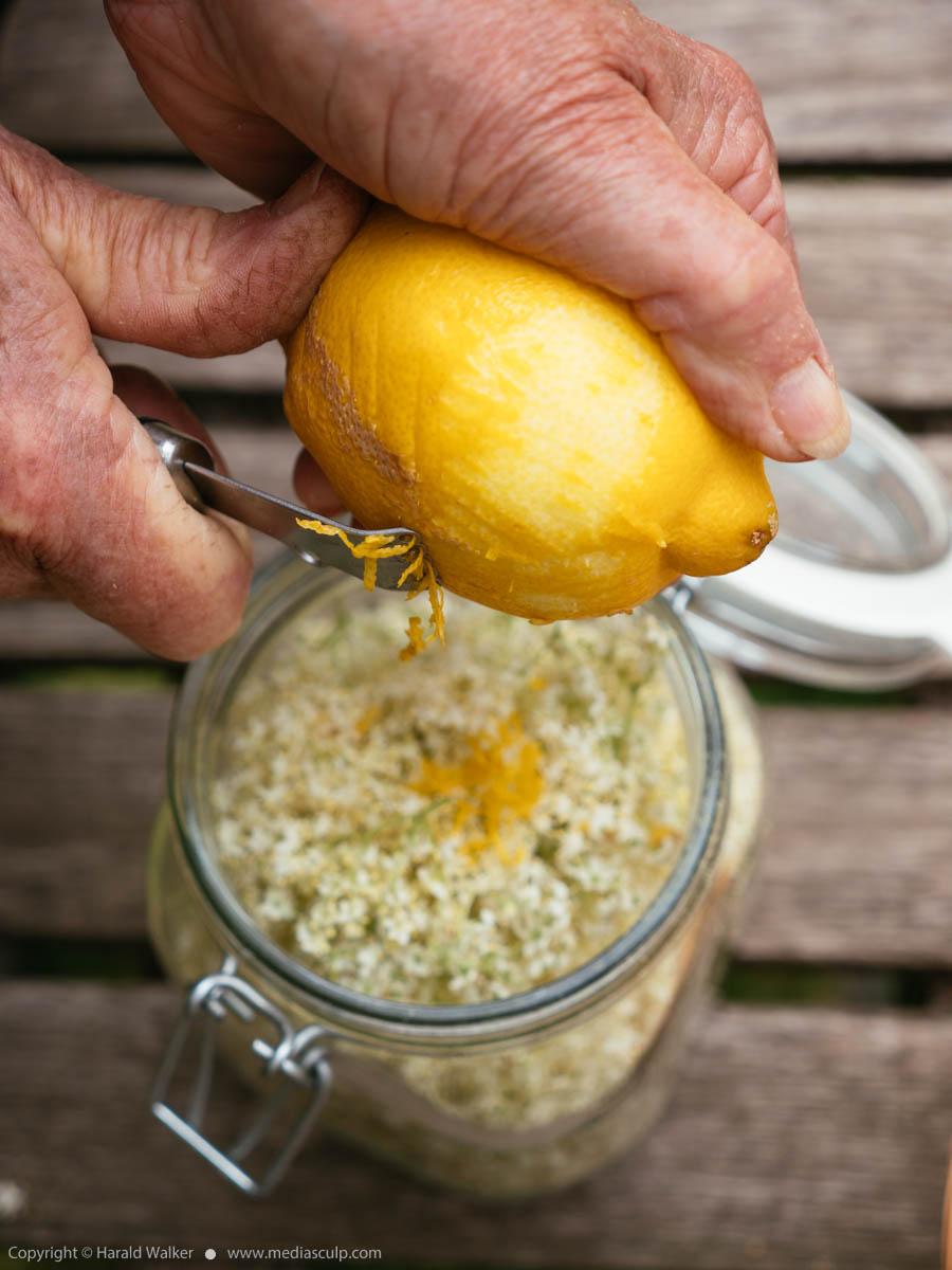 Stock photo of Adding lemon zest