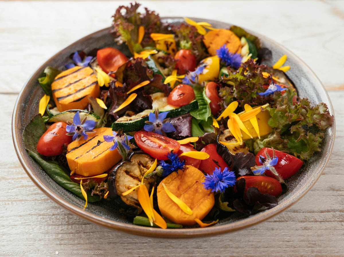 Stock photo of Mixed Green Salad with Grilled Veggetables and Edible Flowers