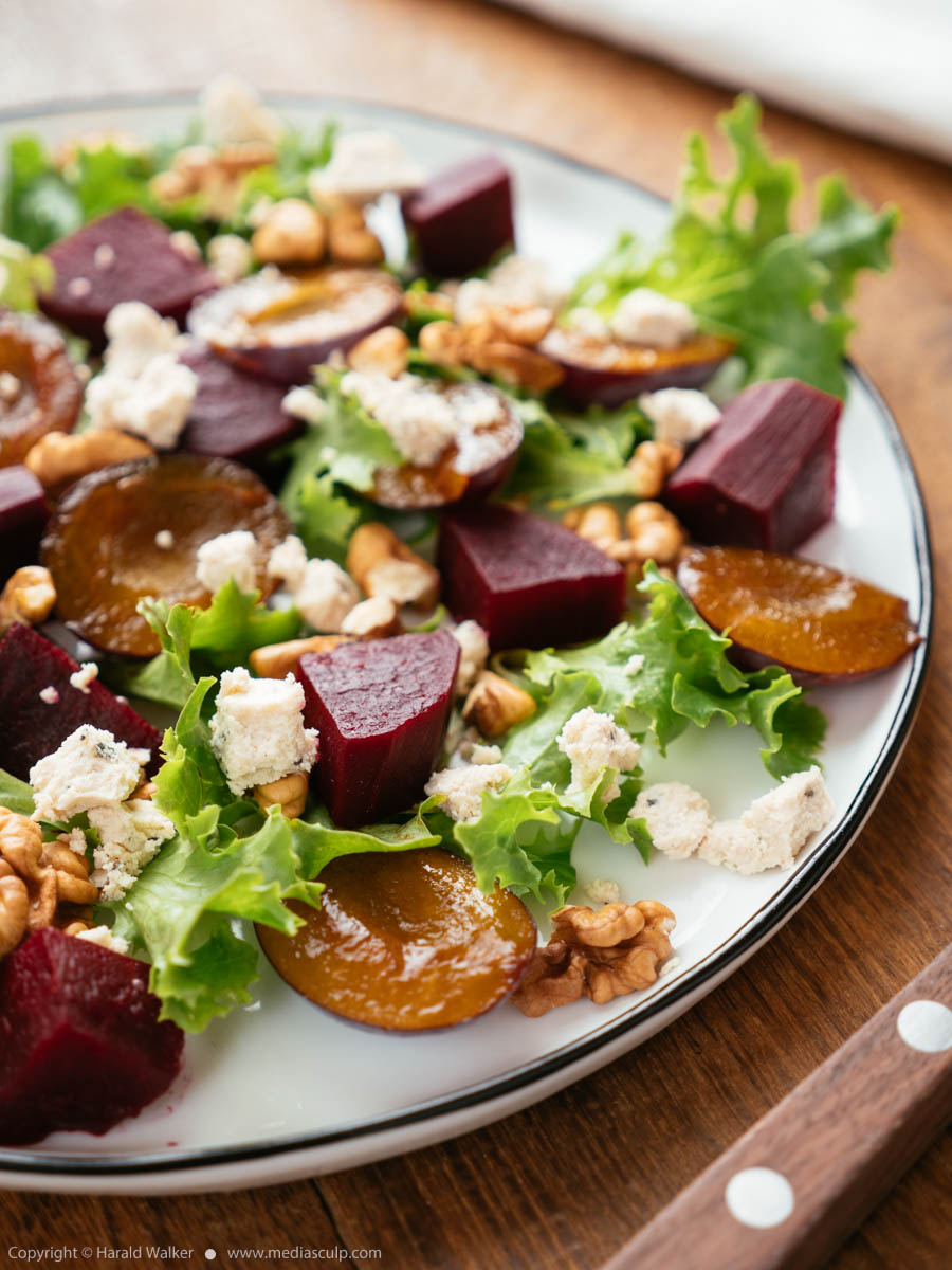 Stock photo of Beet Salad with Plums, Walnuts and Vegan Feta