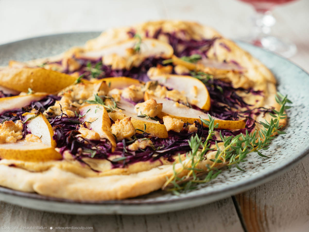 Stock photo of German Flammkuchen with Red Cabbage, Pears and Vegan Feta