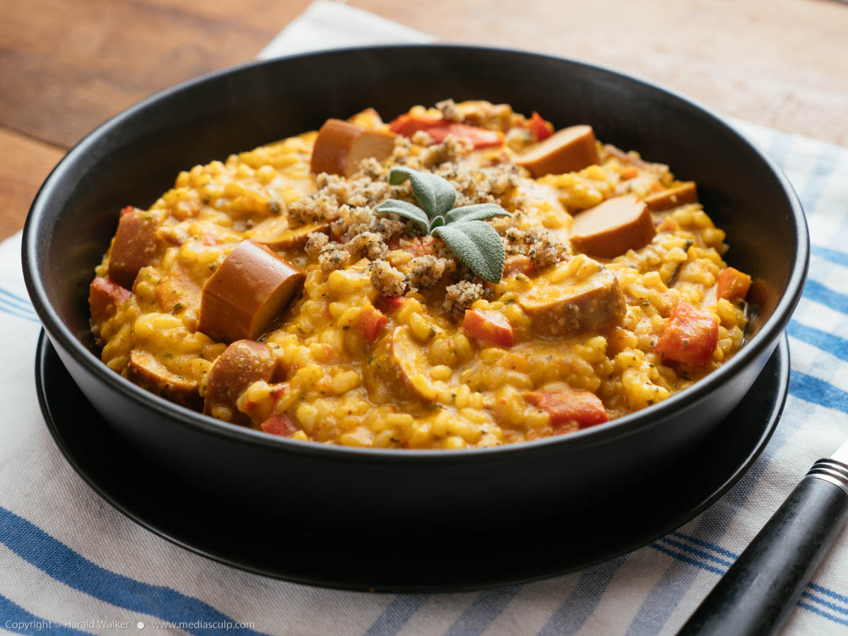 Stock photo of Winter Squash Risotto with Vegan Hot Dogs