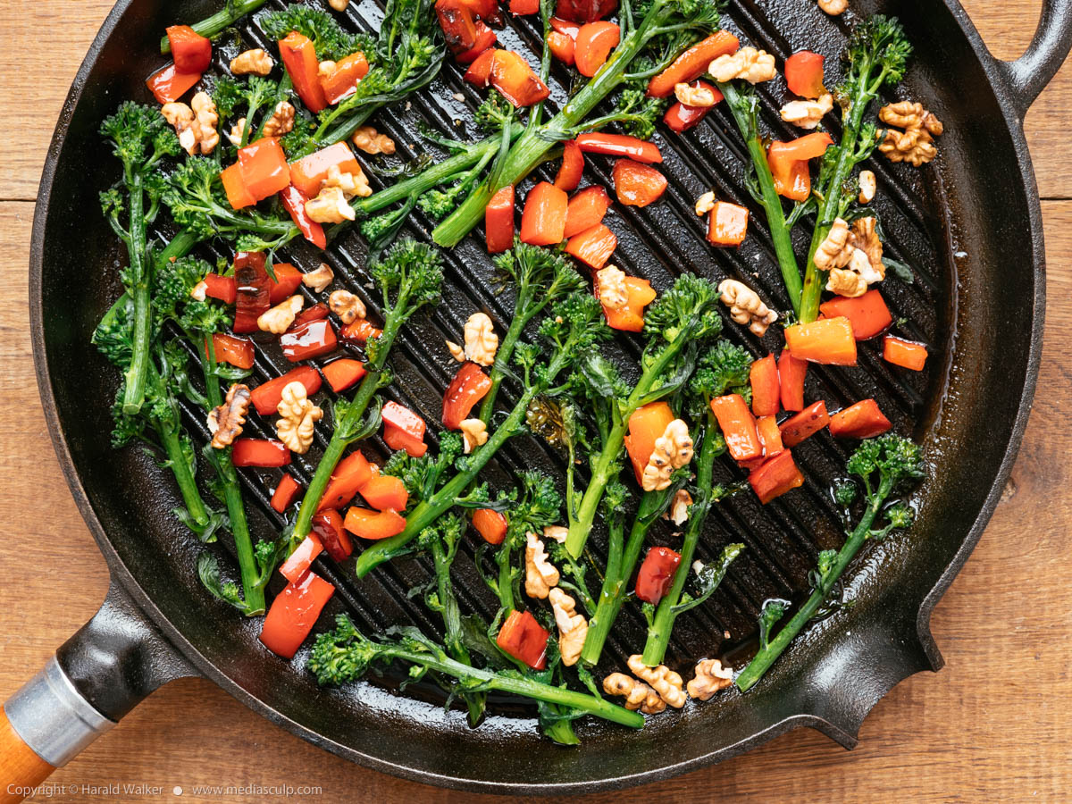Stock photo of Grilled Sprouting Broccoli with Red Bell Peppers and Walnuts