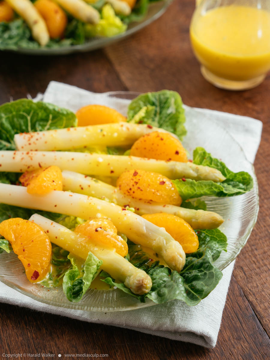 Stock photo of White Asparagus on Lettuce with Orange Dressing