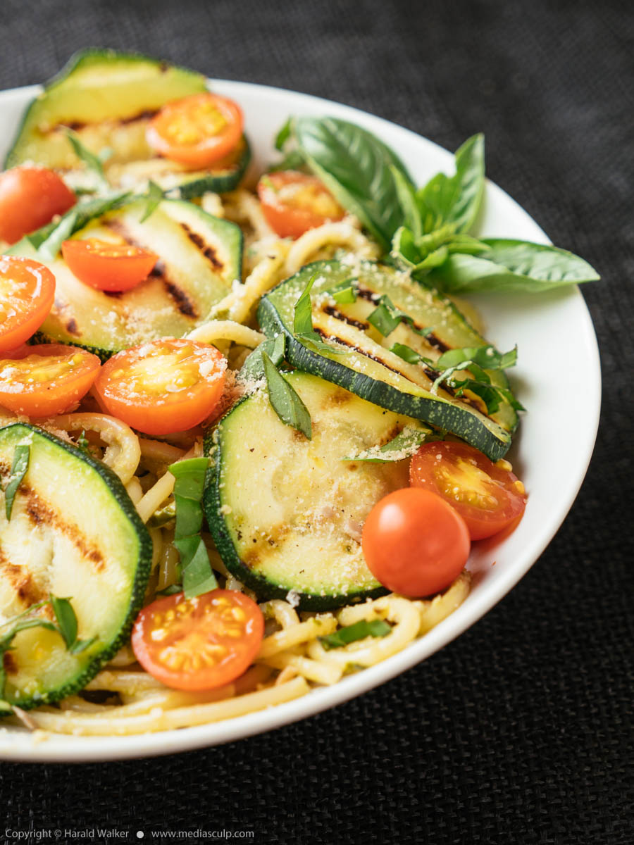 Stock photo of Pasta with Basil Pesto, Grilled Zucchini and Cherry Tomatoes