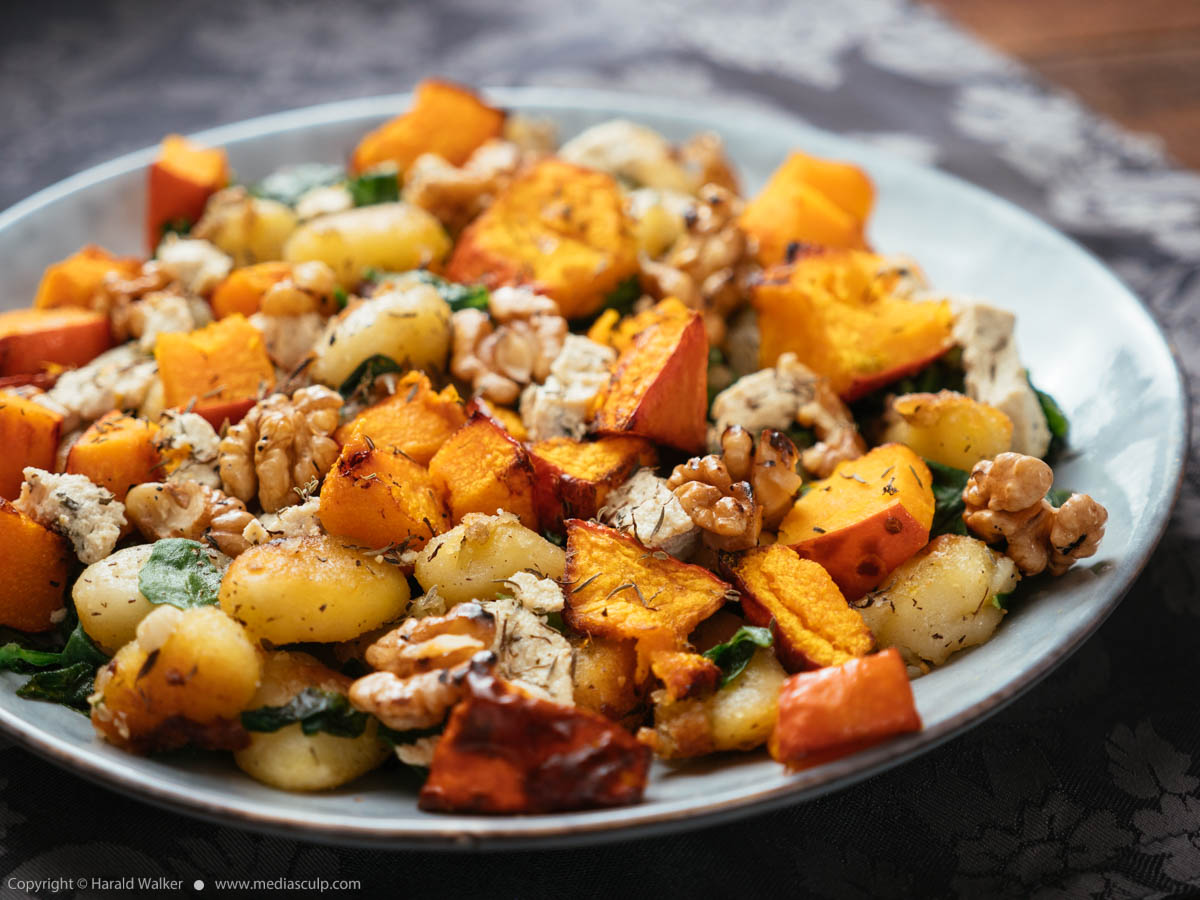 Stock photo of Gnocchi with Roasted winter Squash, Spinach and Walnuts