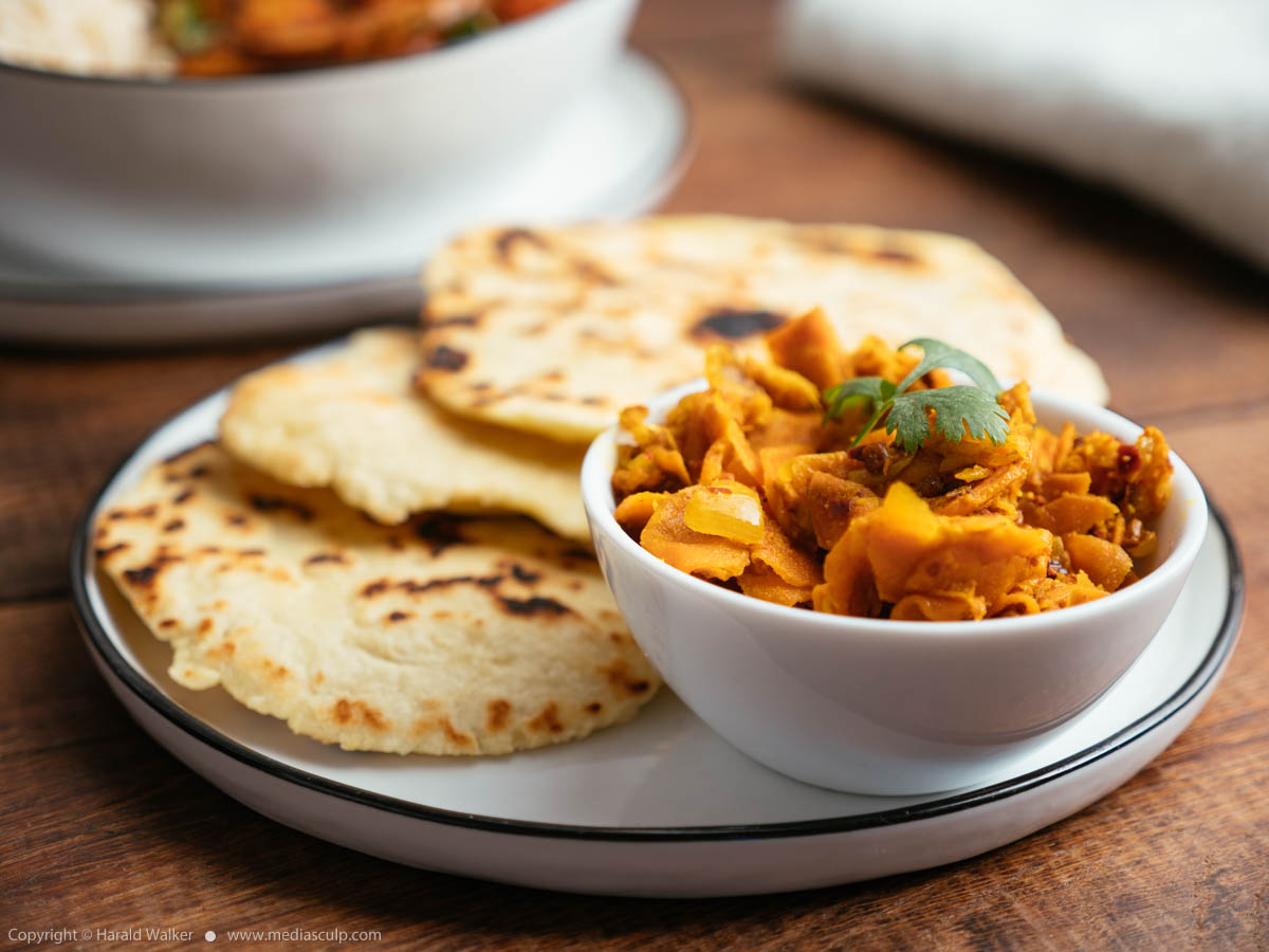 Stock photo of Naan bread and carrot and ginger pickle