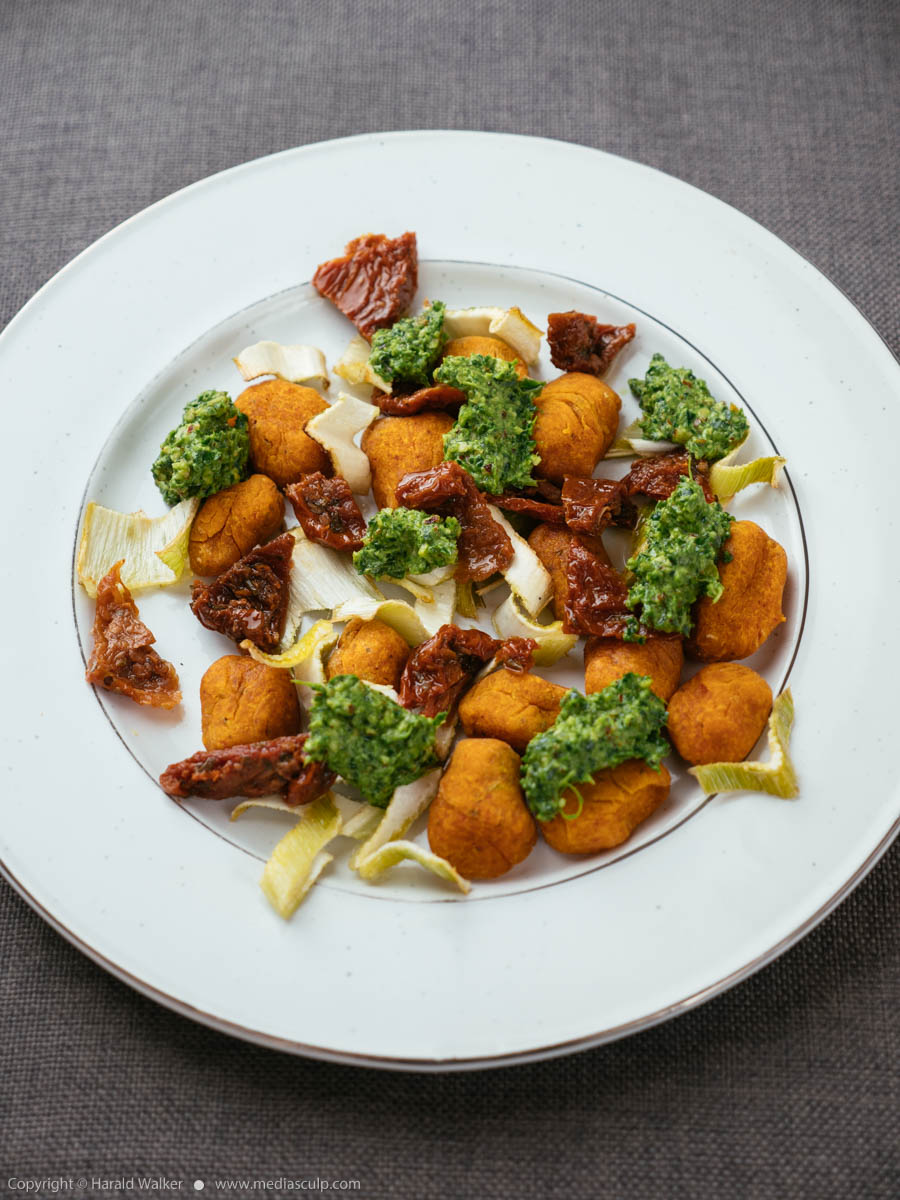 Stock photo of Winter Squash Gnocchi with Roasted Fennel and Spinach Pesto