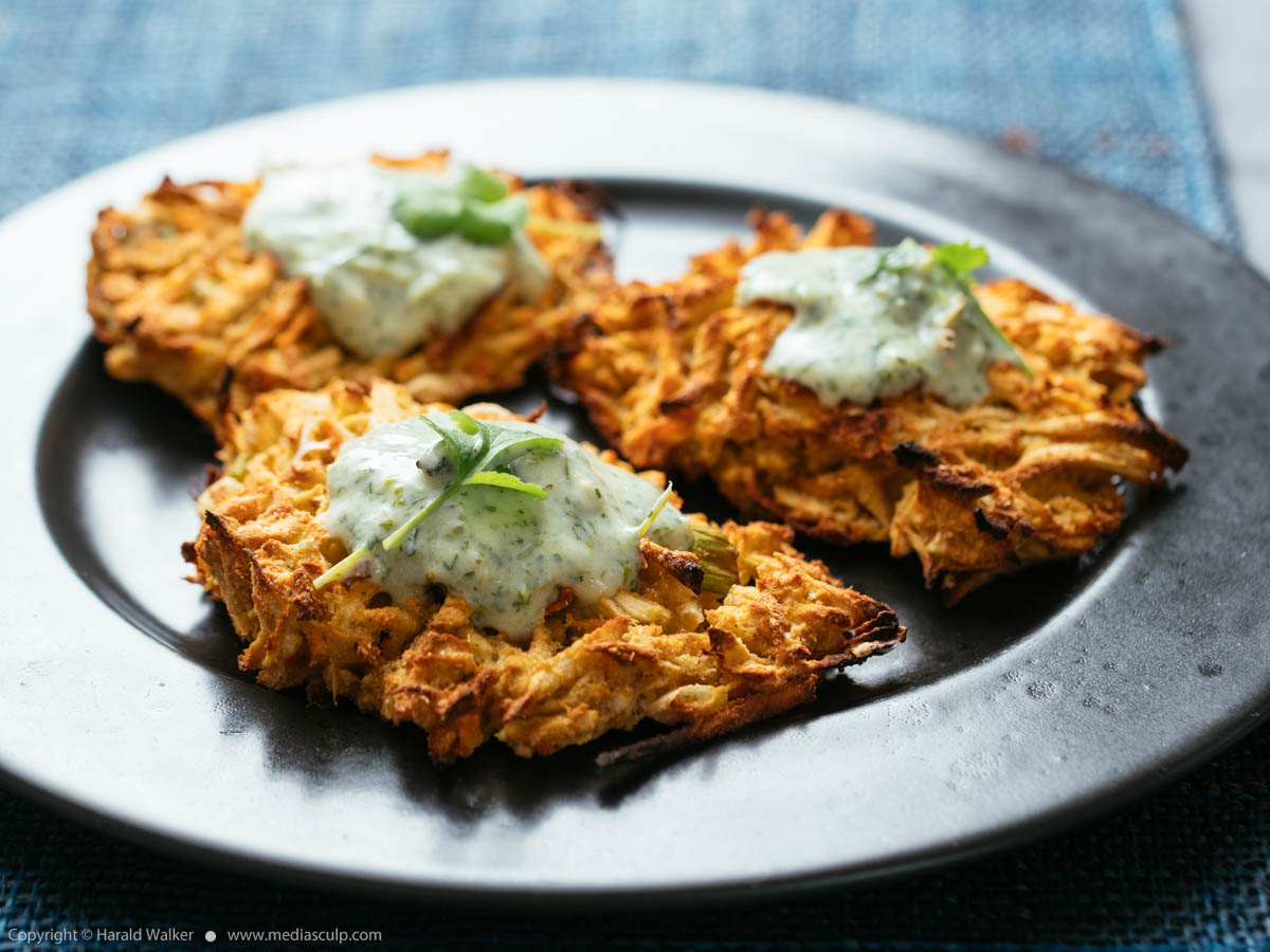 Stock photo of Parsnip, Carrot Fritters with Yogurt Zhoug Sauce