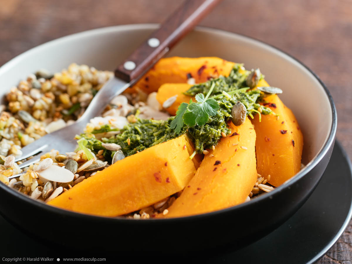 Stock photo of Roasted Squash, Seeded Herbed Freekeh and Zhoug