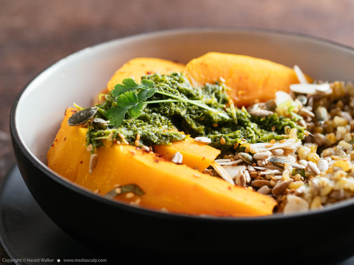 Stock photo of Roasted Squash, Seeded Herbed Freekeh and Zhoug