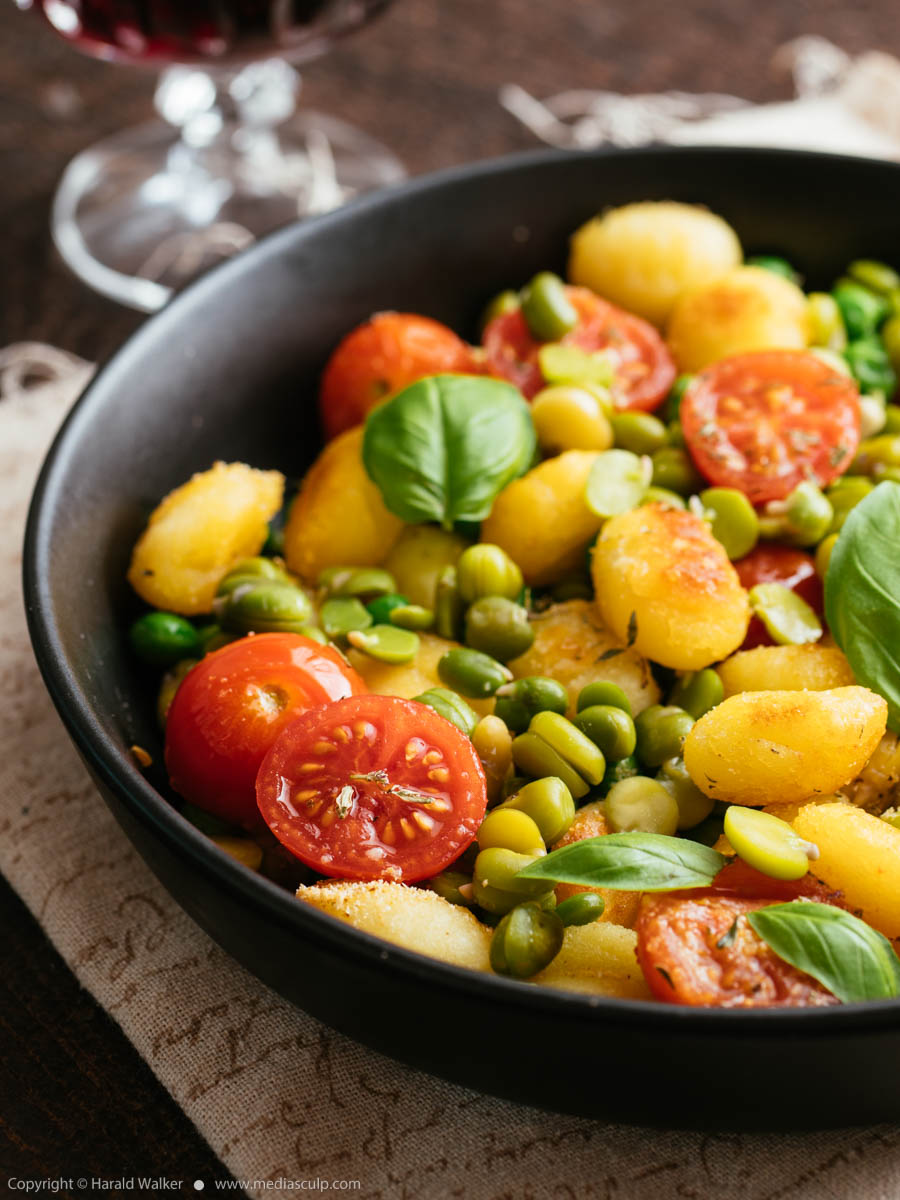 Stock photo of Roasted gnocchi with legumes