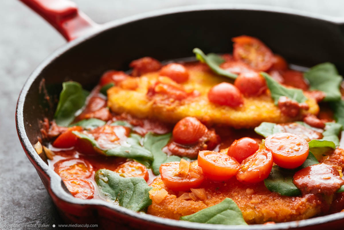 Stock photo of Vegan Chickun Fillets with Cherry Tomatoes and Spinach