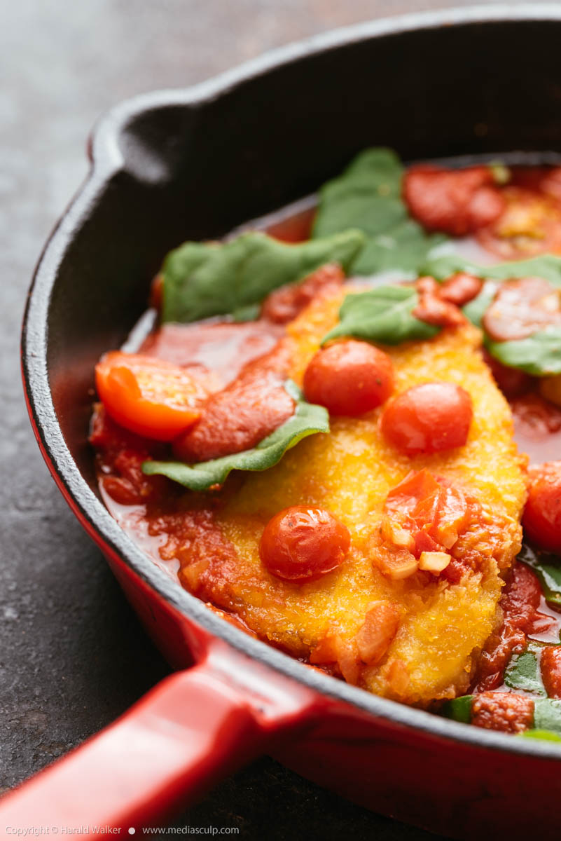 Stock photo of Vegan Chickun Fillets with Cherry Tomatoes and Spinach