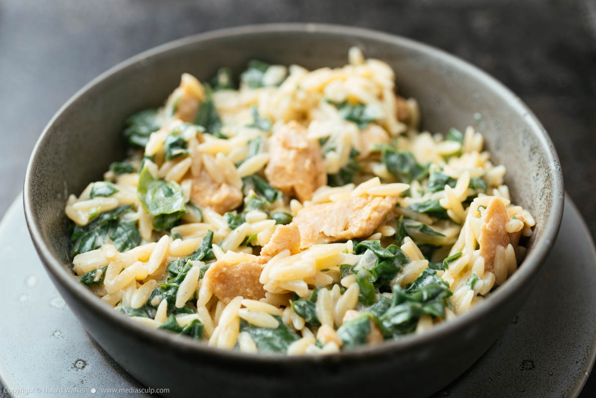 Stock photo of Garlicky Orzo with Vegan Creamed Spinach and Chickun