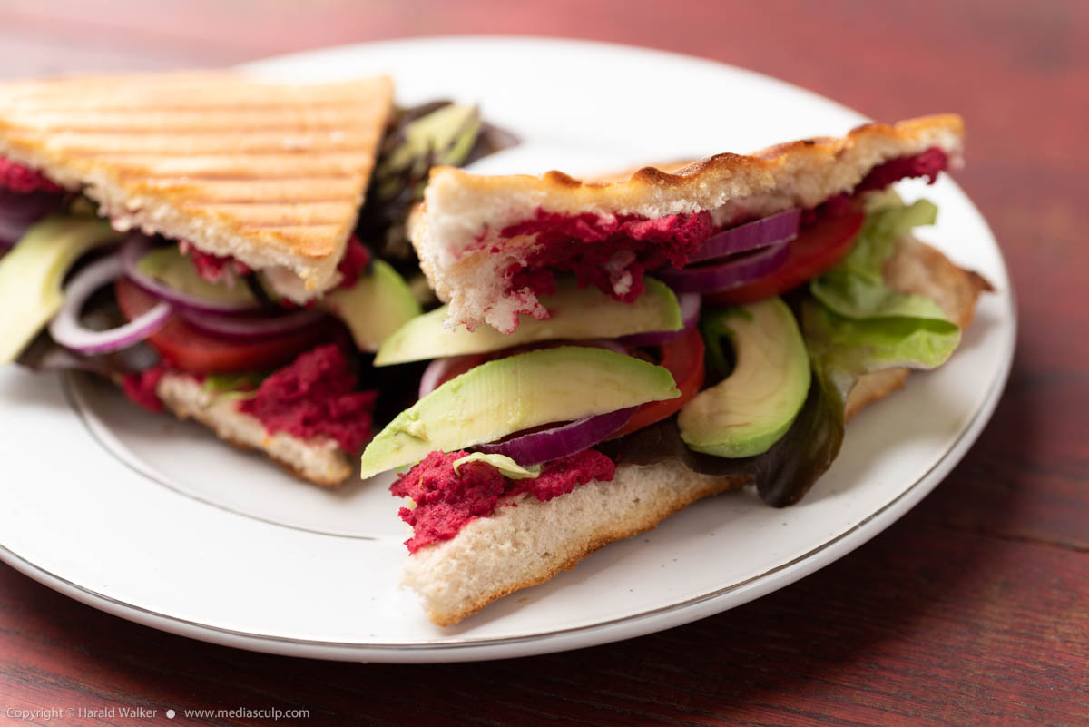 Stock photo of Flatbread with Beet Hummus and Avocados