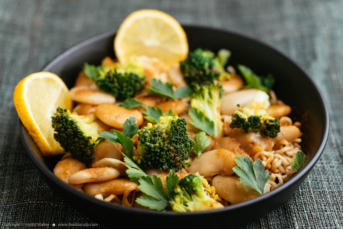 Stock photo of Broccoli and Gigante Beans on Noodles with Lemon Garlic Miso Sauce
