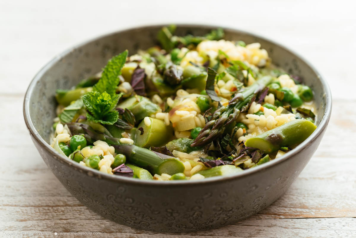 Stock photo of Spring Risotto with Asparagus, Peas, Lemon and Mint