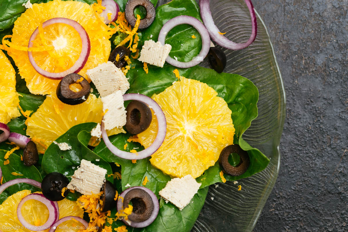 Stock photo of Spinach Salad with Oranges, Black Olives, and Red Onions