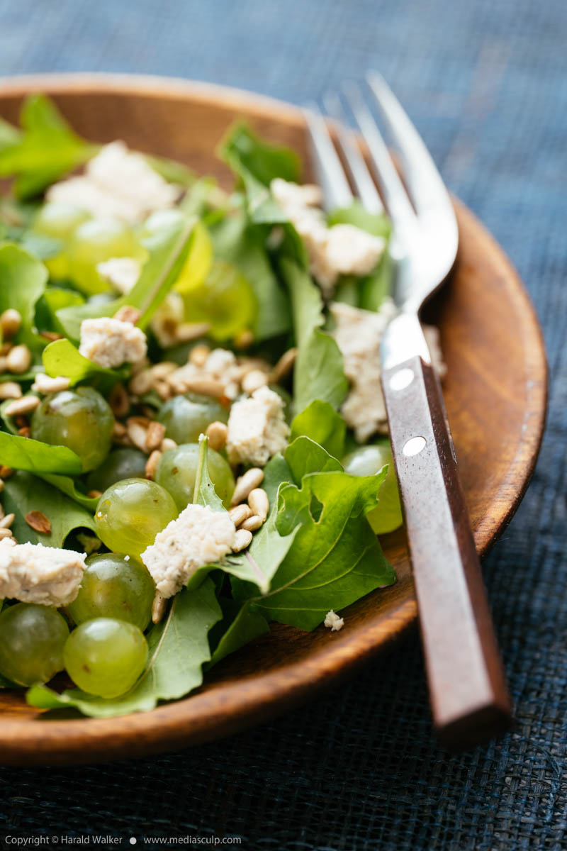 Stock photo of Arugula with Grapes, Feta and Sunflower Seeds