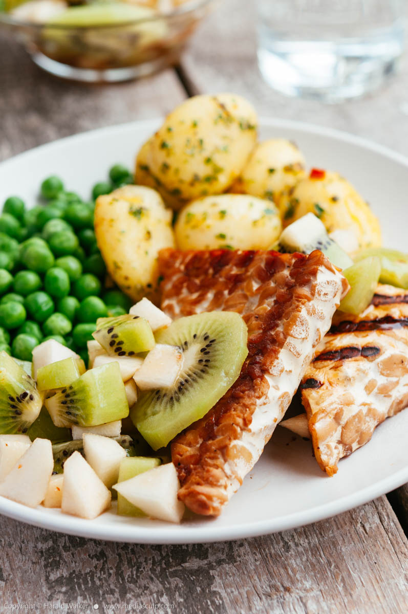 Stock photo of Grilled Tempeh with Kiwi and Pear Salsa