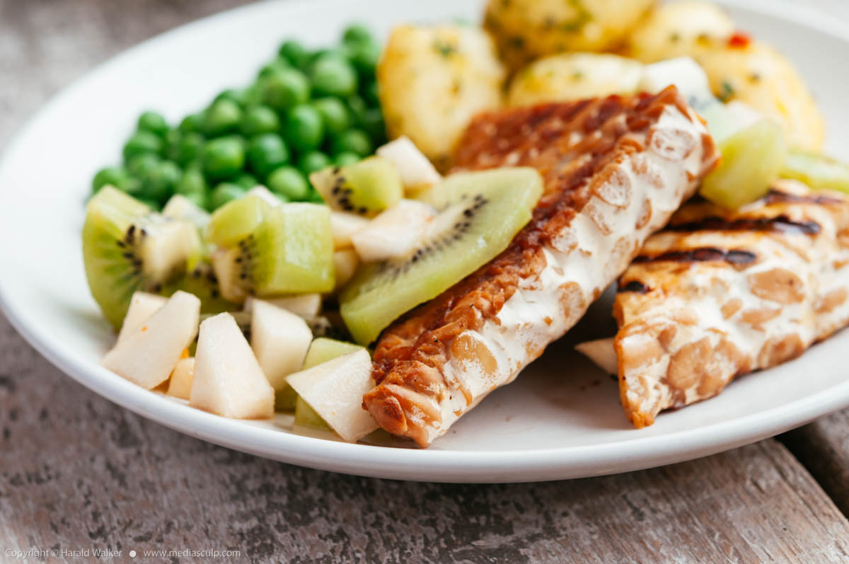 Stock photo of Grilled Tempeh with Kiwi and Pear Salsa