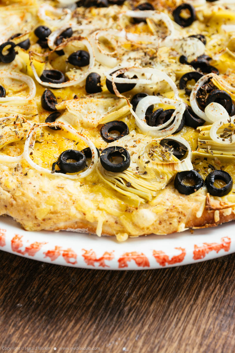 Stock photo of Artichoke and black olives pizza