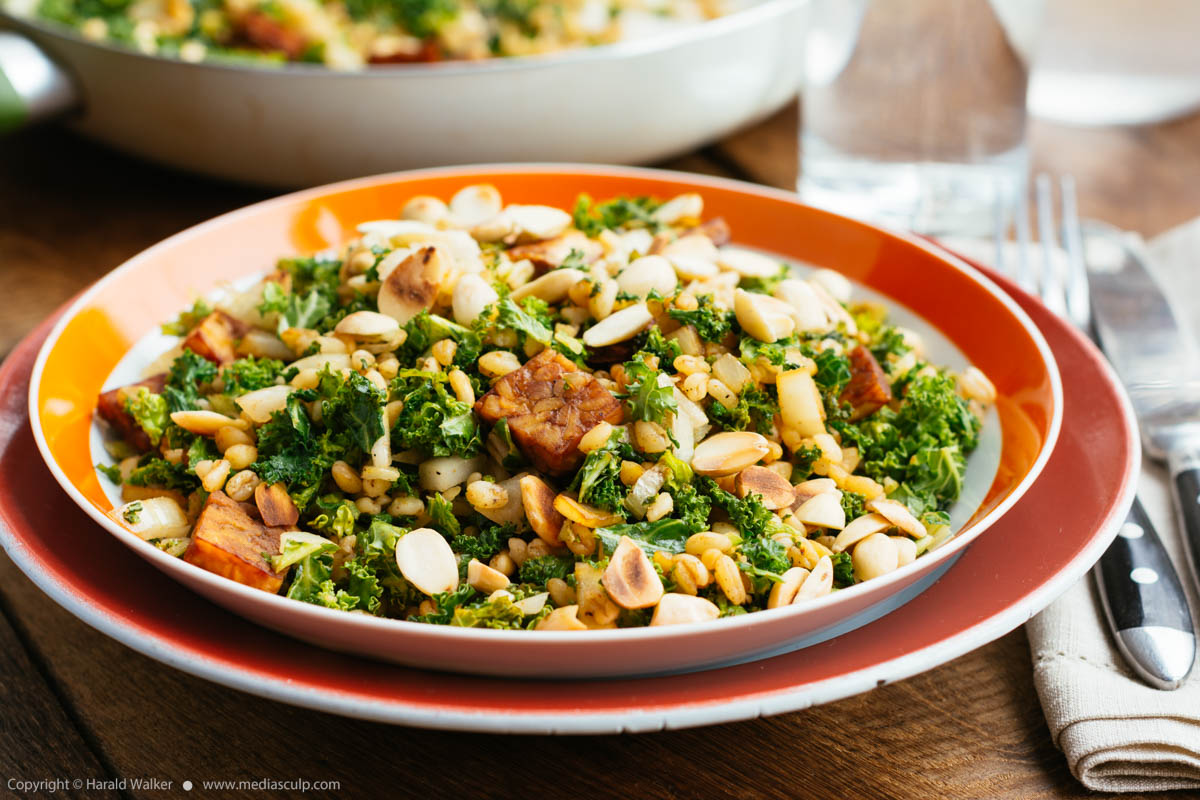 Stock photo of Barley pilaf with kale and toasted almonds